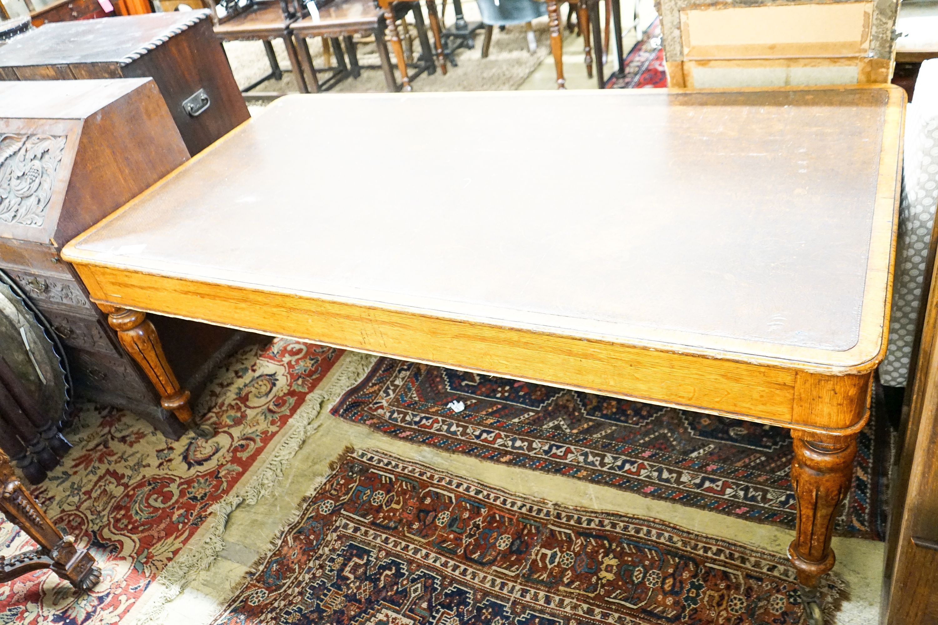 An early Victorian oak library table fitted two end drawers, from the Library of The Royal College of Surgeons, London, width 196cm, depth 105cm, height 76cm